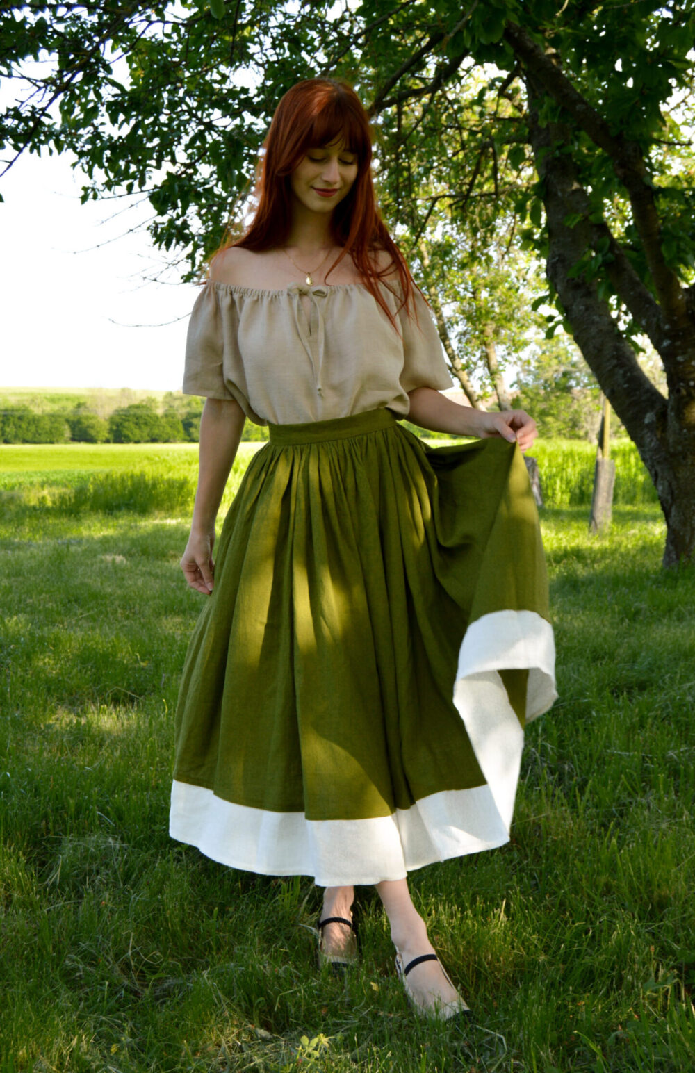 Beige linen chemise blouse with short sleeves and linen gathered moss green skirt