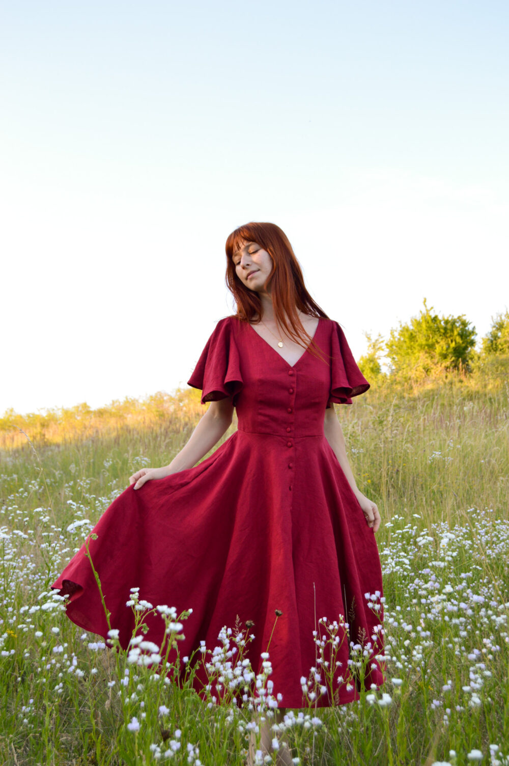 Women's linen dress Charlotte in burgundy color, with a V-neckline, buttons and butterfly sleeves