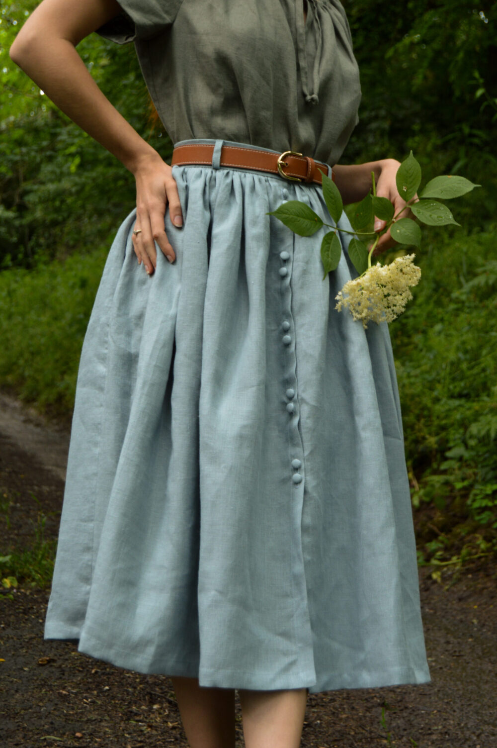 Linen chemise blouse in sage green color and violet buttons skirt in linen powder blue Linen chemise blouse in sage green color and violet buttons skirt in linen powder blue