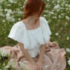 Magnolia top slovakmeadows Off-shoulder linen top with a romantic flounce, delicate lace trim, and an adjustable waist tie.