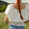 Magnolia linen top slovakmeadows Off-shoulder linen top with a romantic flounce, delicate lace trim, and an adjustable waist tie.